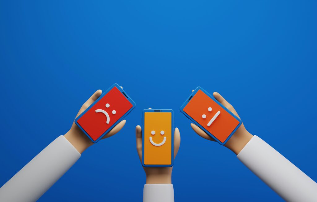 3 hands holding three phones with animated screens with a blue background.